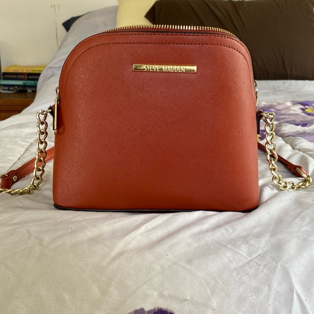 Steven madden burnt orange purse.
